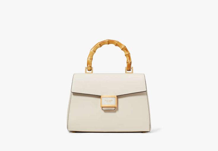 Luxury Chic Kate Spade Bags, Luxury Kate Spade Textured Leather Bag, Kate Spade Top Handle Satchel For On-the-go, Top Handle Satchel With Magnetic Closure, On-the-go Top Handle Bag With Magnetic Closure, On-the-go Bags With Magnetic Closure And Top Handle, Kate Spade Shoulder Bag With Gold-tone Hardware, Chic Medium Bag With Gold-tone Hardware, Chic Medium Satchel With Top Carry Handle