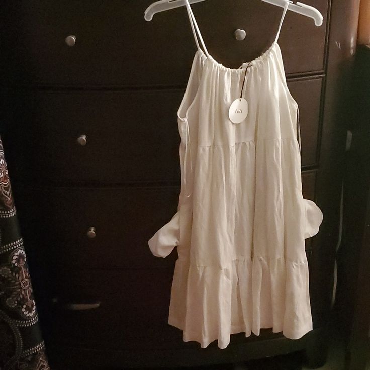 Nia Brand Size L 60% Tencel 40% Linen White White Flowy Tiered Dress For Vacation, Flowy White Tiered Dress For Vacation, White Summer Tiered Dress, White Flowy Tiered Summer Dress, Daytime A-line Sundress, Casual A-line Mini Dress For Daytime, White Summer Tiered Dress For Vacation, Breezy Sundress For Daytime, Chic A-line Sundress For Daytime