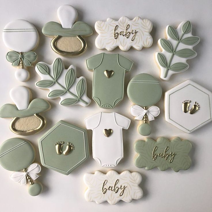 baby shower cookies are arranged on a table