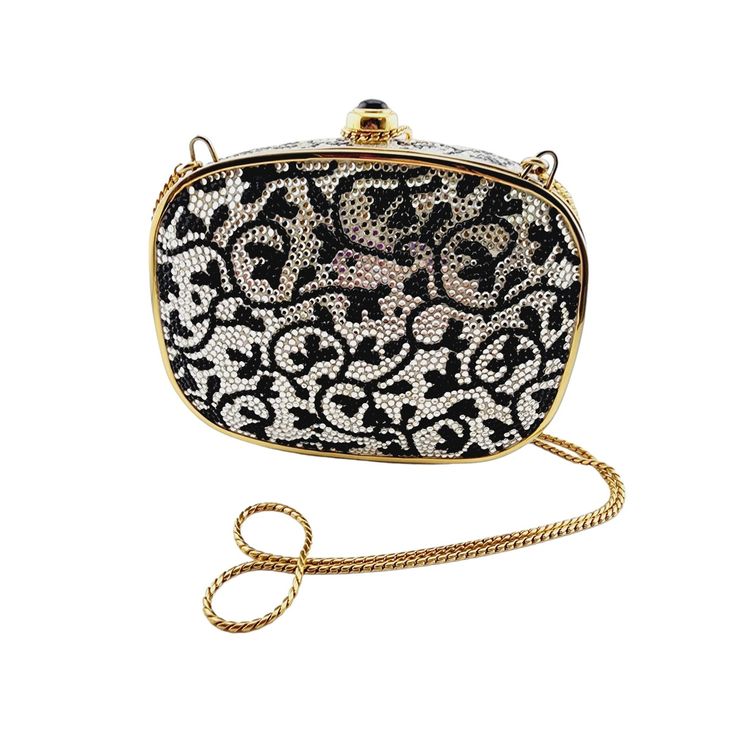 "Vintage Beautiful Judith Lieber Minaudiere With Dust Bags And Accessories 6/17 Size: Bag is 5\" x 3.5\" x 1\", chain is 21\", mirror is 3\" Color: Gold, Black Condition: Very Good Signed: Judith Lieber Details: Absolutely wonderful bag; all stones are there; glass closure; leather lined; does have a little wear to the leather inside. Includes a dust bag for the bag and a dust bag for the mirror, which moves; there is some black to the mirror; it will need cleaning; Comb is signed and has the leather coin purse. Please look at all the photos, as they are part of the description. I try my best to point out any flaws. Also please remember this is a preloved piece and may show signs of light wear, scratches, marks, etc. I will be posting a lot more, checking back! Thanks for looking." Judith Leiber Bags, Coral Bracelet, Bags Vintage, Leather Coin Purse, Judith Leiber, Bags And Accessories, Clutch Handbag, Evening Clutch Bag, Beautiful Bracelet