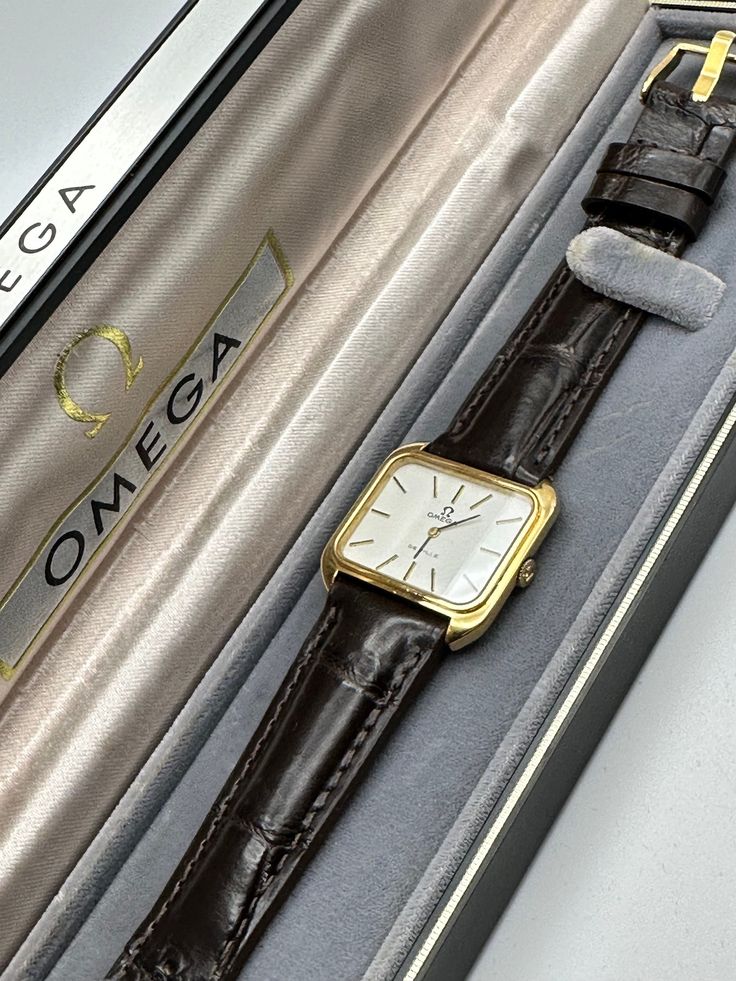 This Omega De Ville wristwatch is a stunning vintage timepiece that any watch enthusiast would be proud to add to their collection. With its elegant gold case color and stainless steel case material, it exudes sophistication and style. The mechanical (manual) movement ensures precision timekeeping and the leather band material adds a touch of luxury to the design. The watch is unisex, making it a versatile accessory for any occasion. Whether you're dressed up for a special occasion or keeping it casual, this Omega De Ville watch is a statement piece that is sure to impress. Comes with omega box, band is aftermarket. Vintage Timepiece, Gold Case, Women Wrist Watch, Wrist Watches, Leather Band, Stainless Steel Case, Time Piece, Womens Watches, Wrist Watch