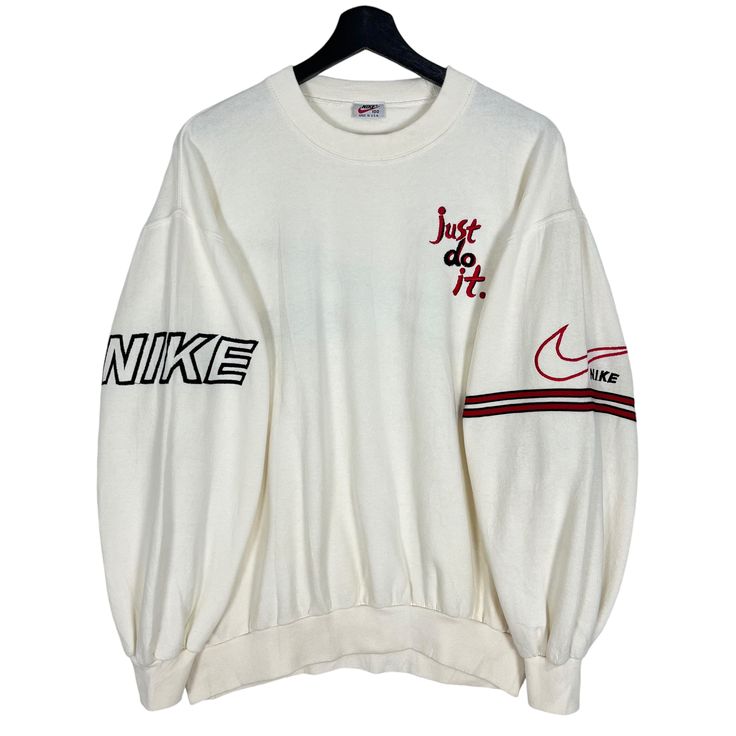 Vintage 90's Nike Just Do It Embroidery Sleeve Logo Sweatshirt White Cream Size M Made in USA  * Size on Tag : 100 * Manual Measurement (inch) : Chest (pit to pit) 24, Length 24, Shoulder 22, Sleeve 20.5, Hem 16. * Recommended for Size : Medium (M) * Measurement was taken lying flat without stretching. * Color : White Cream  * Condition : Other than STAINS, all in good vintage condition. * See photos for details. * Free Defect : No Holes, No Tears, No Faded. SW 3 / XX Nike Vintage Sweatshirt Creme, 90s Long Sleeve Tops With Embroidered Logo, Streetwear Crew Top With Embroidered Logo, Streetwear Long Sleeve Tops With Embroidered Logo, Long Sleeve Tops With Embroidered Logo For Streetwear, 90s Style Winter Tops With Embroidered Logo, Long Sleeve Tops With Embroidered Graphics For Streetwear, 90s Style Crew Neck Sweatshirt With Embroidered Graphics, 90s Embroidered Long Sleeve Sweatshirt