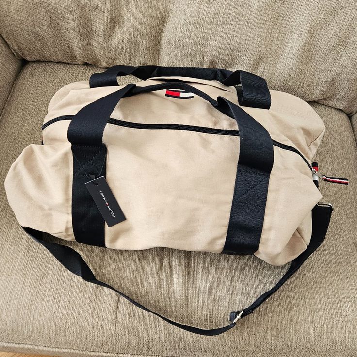 This Duffel Bag Is Brand New, No Issues Or Damage. Measures 20in X 13in X 10in, Can Be Stuffed Bigger That That Of Course. It's A Good Size For A Personal Item For Traveling Feel Free To Comment With Any Questions Functional Beige Bag For Overnight Trips, Casual Beige Tote Duffle Bag, Casual Beige Duffle Bag Tote, Casual Beige Bag For Overnight Trips, Beige Tote Duffle Bag With Zipper Closure, Beige Rectangular Bag For Overnight Trips, Beige Shoulder Duffle Bag For On-the-go, Beige Shoulder Duffle Bag For Daily Use, Casual Beige Bags For Weekend Trips