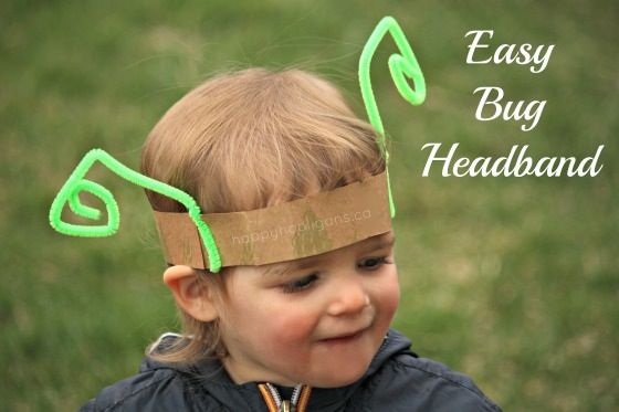 a little boy wearing a paper headband with scissors in it's hair and the words earth day, but not headscarves