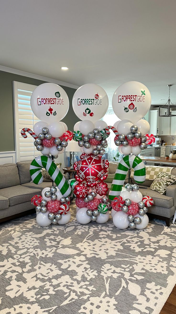 a living room filled with christmas decorations and balloons