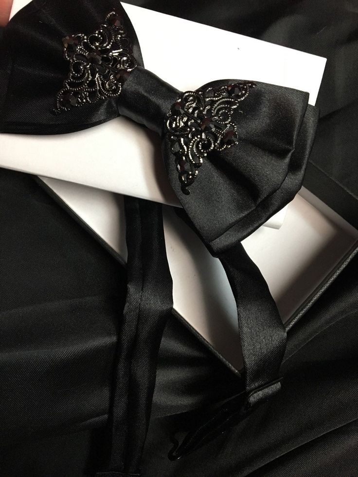 Black satin bow tie with adjustable strap. So amazing! Much better than a regular boring bow tie. Elegant Satin Tuxedo For Party, Black Satin Tuxedo For Formal Events, Black Satin Tuxedo For Formal Occasions, Elegant Fitted Bow For Gift, Elegant Fitted Bow As Gift, Elegant Black Satin Tuxedo, Adjustable Classic Bow Tie For Party, Dapper Bow With Decorative Detail For Party, Tuxedo Bow For Black-tie Events