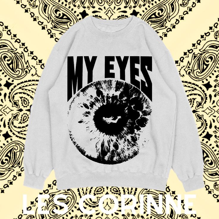 Crafted from premium cotton-blend materials, our Travis Scott Look In My Eyes Sweatshirt is designed for comfort and style. The fabric is soft to the touch, providing a cozy fit perfect for any casual outing. Available in multiple sizes, this statement piece offers a relaxed yet snug fit for all body types. The high-quality print ensures the design remains vibrant and intact wash after wash, making it a lasting addition to your wardrobe. Ideal for hip-hop enthusiasts and streetwear aficionados, this sweatshirt features a bold Travis Scott graphic that is sure to turn heads. Whether you're running errands, attending a concert, or just lounging at home, this versatile piece of clothing makes a fashionable statement. It's a great conversation starter and a stylish way to show your love for Tr Cotton Relaxed Fit Sweatshirt For Fan Merchandise, White Graphic Design T-shirt, Band Merch Sweatshirt With Logo Print For Fall, Band Merch Logo Print Sweatshirt For Fall, Fall Band Merch Sweatshirt With Logo Print, White Screen Print Band Merch Sweatshirt, White Oversized Band Merch Sweatshirt, Winter Cotton Tops With Front Print, Band Merch Crew T-shirt For Winter