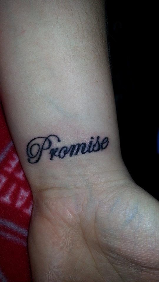 a small wrist tattoo with the word promise on it's left side arm