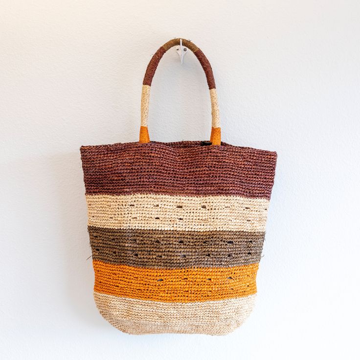 IN STOCK FAST SHIPPING FROM LOS ANGELES This large tote is the ultimate summer bag, perfect for a day at the beach or a casual chic outing. Made of natural soft raffia straw and accented with colorful stripes, this durable and fashionable tote is a must-have accessory. Stay on trend with this versatile and stylish bag. Dimensions: 16"H x 17"W Designer Style ID: 8634 Beach Woven Hobo Bag With Top Handle, Beach Woven Top Handle Hobo Bag, Woven Top Handle Hobo Bag For Beach, Beach Hobo Bag With Double Handles, Beach Season Shopping Tote Hobo Bag, Eco-friendly Handwoven Hobo Bag For Vacation, Beach Season Shopping Hobo Bag, Summer Hobo Bag With Leather Handles, Beach Hobo Bag With Leather Top Handle