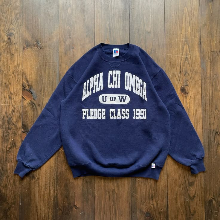 Vintage 1991 Alpha Chi Omega University Fraternity Sorority College Varsity Crewneck Sweatshirt / made in USA / size XL Pit to Pit:      22" Length:      26" Sleeve:       30" Please check the measurements before purchasing.  -------------------------------- ⚠️ Please Note: All of our items are vintage. Please note that with vintage clothing, items may show some signs of wear. We do our best to include as much information about the items condition as possible. Please look carefully through the p Vintage Graphic Print Top For Campus, Vintage College Sweatshirt With Text Print, Vintage Crew Neck Tops For Campus, Vintage Graphic Print Sweatshirt For Campus, Vintage Oversized Tops With Lettering, Vintage Oversized Top With Lettering, Vintage Sweatshirt With Letter Print For Campus, Sorority Sweatshirt Design, Aphi Merch