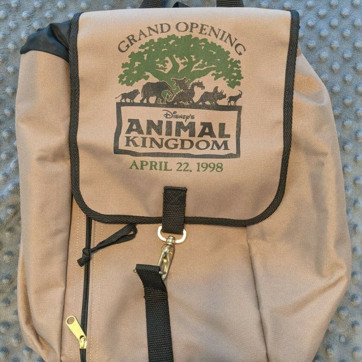 Like New & Very Rare Disney's Animal Kingdom Opening Day/ Grand Opening Backpack. Condition Is "Like New" Euc- No Tags But Never Used. No Visible Wear And Tear Or Stains. Zipper Works; No Snags. Slight Sewing Defect At The Bottom Seam (Pictured) But Is Not Separating. This Cinch Style Backpack Was Only Sold For The Grand Opening Of Disney's Animal Kingdom On Earth Day, 1998. It Features A Graphic Of The Tree Of Life With Icons From Each Area Of The Dak Marching In Front, Including The Dragon Fro Disney Style Daily Backpack, Disney Backpack For Daily Use, Disney Travel Backpack, Brown Disney Bags For Everyday Use, Disney Style Backpack For Travel, Disney Style Brown Bag For Everyday Use, Disney Everyday Brown Bags, Disney Rectangular Backpack For Everyday Use, Disney Themed Rectangular Backpack For Everyday Use