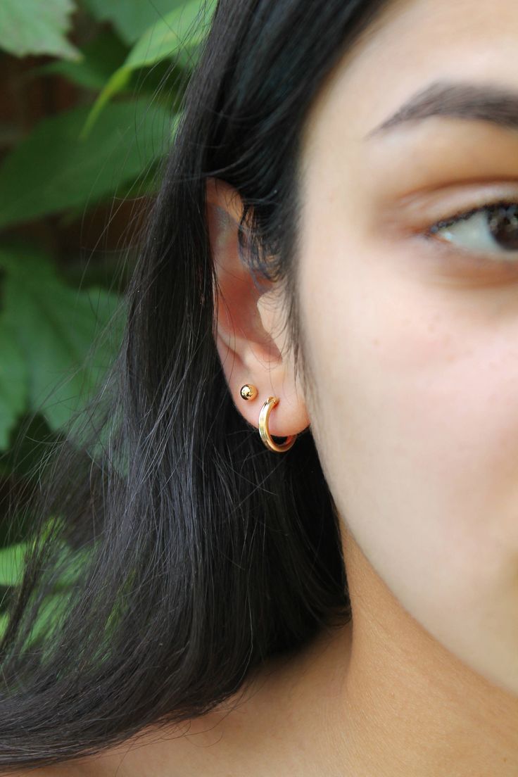 Little gold hoops and ball-post studs, all 14k gold filled. Will never ever tarnish or rust!! As good as gold :) Great everyday basics and perfect for multiple piercings. Please select the earrings you need from the dropdown menu *Sorry - the ball post studs are temporarily out of stock. Components: Hoops - 14Kt Gold Filled, 13mm in diameter, about 2mm wide tube Ball post studs - 14k gold filled, 4mm *14k gold filled components are made with a layer of pure gold over brass base. What you see and Minimalist 14k Gold Filled Cartilage Earrings For Everyday, Dainty 14k Gold Filled Piercings For Everyday, Gold Hoop Piercings In Minimalist Style, Gold Hoop Piercings Minimalist Style, Minimalist Gold Hoop Piercings, Dainty Gold Small Hoop Wrap Earrings, Minimalist Gold Piercings With Matching Earrings, Minimalist 14k Gold Filled Piercings, Gold Dainty Huggie Wrap Earrings