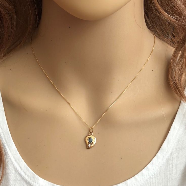 Description: 14k Solid Yellow Gold Mini Leaf Sapphire Dainty Pendant Necklace - Minimalist Item No.: P.86/373 Metal Type: 14k Solid Gold Metal Color: Yellow Gold Type Of Stone: Natural Sapphire And Cubic Zirconia Measurement: Pendant With Bale: 10 X 17 Mm. Chain Length: 16" Or 18" Approximate Weight: Total Est. Weight: 1.99 Or 2.09 Grams (0.86 Grams Pendant, 1.13-1.23 Grams Chain) Brand New With Box Yellow Gold Plated Birthstone Pendant Necklace, Gold Plated Yellow Gold Birthstone Pendant Necklace, Yellow Gold Birthstone Heart Pendant Necklace, Gold Heart-shaped Birthstone Necklace With Gemstone, Yellow Gold Necklace For May Birthstone Gift, Gold Heart-shaped Birthstone Necklace, May Birthstone Yellow Gold Necklace For Her, Gold Birthstone Necklace Gift For Her, Gold Birthstone Necklace In Fine Jewelry Style