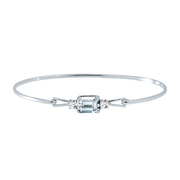 One of our most elegant bracelets is decorated with a large pale blue aquamarine in a square emerald cut complemented by a small diamond on either side. A beautiful gift for special occasions.Aquamarine was believed to be the treasure of mermaids. Be a one with this bracelet. #klenota #klenotajewelry #klenotabracelet #whitegold #14k #14carat #bracelet #aquamarine #diamond #luxurygift #aquamarinegemstone #bluestone #gemstone #diamondbracelet#jewelrymakers #prettyjewelry #inspiration Elegant Blue Topaz Bracelet, Elegant Silver Bracelet With Blue Topaz, Elegant Aquamarine Silver Bracelets, Elegant Aquamarine Bracelet Jewelry, Timeless Silver Diamond Bracelet With Emerald Cut, Silver Emerald Cut Diamond Bracelet Timeless, Elegant White Gold Bracelet With Blue Topaz, Timeless Silver Emerald-cut Diamond Bracelet, Elegant Blue Topaz Bangle Bracelets