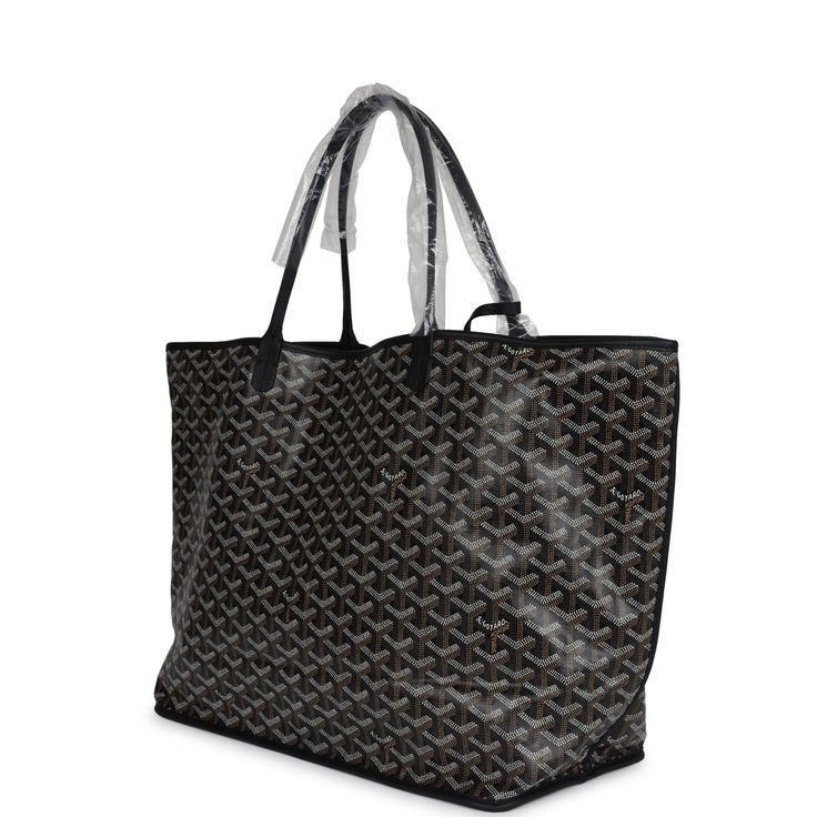 This Goyard Anjou GM tote bag is in Black Goyardine canvas with palladium hardware, tonal titching, black Chevroches calfskin lining, and a detachable black coin purse.This bag is reversible.Origin: FranceCondition: New and never worn (plastic on handles)Accompanied by: Goyard dustbag, retail UPC, removable pouchMeasurements: 15" x 13.4" x 7.8" 7.5" shoulder strap Black Shoulder Bag In Signature Coated Canvas For Travel, Everyday Luxury Coated Canvas Shoulder Bag With Dust Bag, Black Shoulder Bag With Leather Handles And Coated Canvas, Everyday Black Monogram Canvas Shoulder Bag, Top Handle Bag In Monogram Canvas With Palladium Hardware, Black Coated Canvas Shoulder Bag With Leather Handles, Everyday Luxury Bags With Leather And Monogram Canvas, Black Signature Coated Canvas Bag For Everyday Use, Luxury Everyday Monogram Canvas Bag With Leather Trim