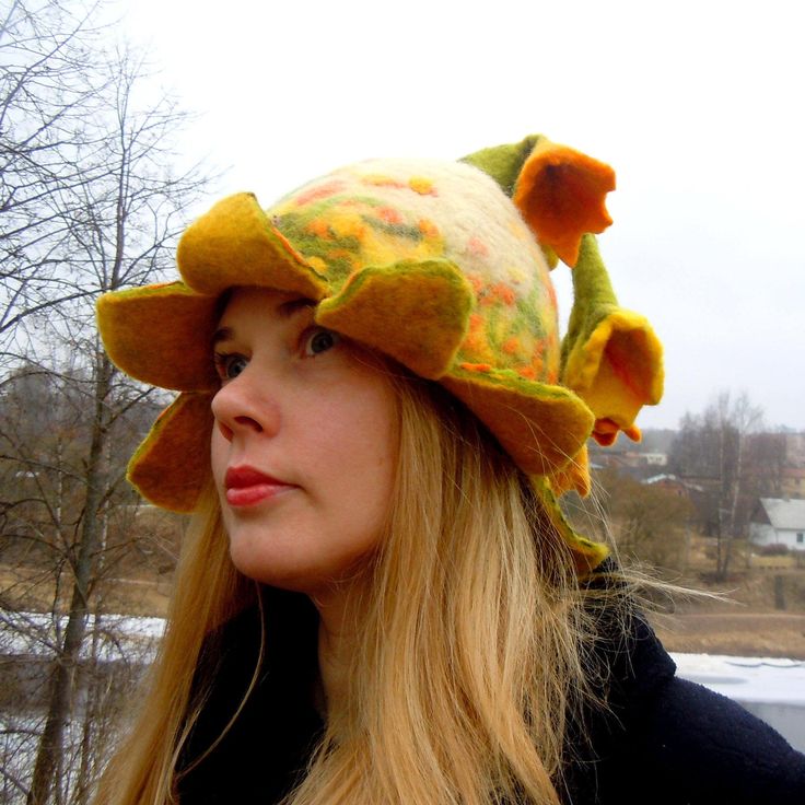 Beautiful bell shaped hat with yellow flowers. Unique hat in which you will feel amazingly good. It is from natural material and created with love. Warmth, coziness, pleasure and festive feeling will embrace you. Good mood is guaranteed. A good gift for a good person. Hat has a wide usage: it can be a sauna hat, an everyday hat, or a hat for a special occasion or teapot warmer. As a sauna hat it will protect your head and hair from the heat, as a street hat it will protect your head from the win Whimsical Winter Hat With Short Brim, Whimsical Wide Brim Winter Hat, Whimsical Winter Hats With Curved Brim, Yellow Flower Hat For Spring, Yellow Flower-shaped Hats For Spring, Handmade Brimmed Whimsical Bonnet, Handmade Yellow Brimmed Hat, Yellow Mini Hats One Size Fits Most, Yellow Handmade Cap