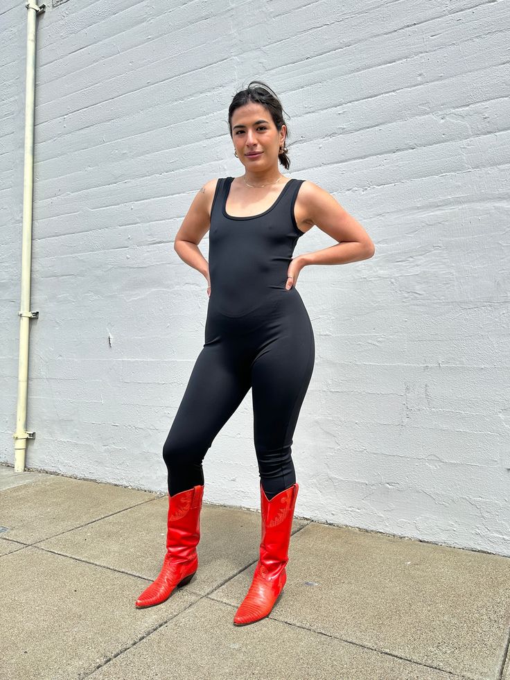 We're pretty sure the scoop neck unitard will be your newest super stretchy BFF! Made from our 100% recycled tricot, this pull on, all-in-one look makes getting dressed a breeze. The unitard has full length legs, a scoop neck and back, and all the stretch you need for a perfect form fitting jumpsuit that can take you from yoga to a night out on the town.🤸‍♀️ High Stretch Full-length Solid Unitard, Full Length High Stretch Solid Unitard, Solid Color High Stretch Full Length Unitard, Summer Stretch Elastane Unitard, Fitted Sleeveless Elastane Unitard, Sleeveless Second-skin Elastane Unitard, Black High Stretch Unitard For Fall, High Stretch Full Length Elastane Unitard, Full Length Compression Unitard