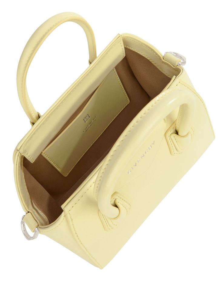 Antigona Handbag Luxury Rectangular Bags With Detachable Handle, Luxury Rectangular Bag With Detachable Handle, Luxury Everyday Baguette Bag With Handles, Designer Handheld Baguette Bag With Top Carry Handle, Luxury Rectangular Baguette Bag With Top Carry Handle, Designer Baguette Bag With Top Handle And Removable Pouch, Designer Top Handle Bag With Detachable Strap, Luxury Baguette Bag With Detachable Strap And Double Handle, Luxury Rectangular Bag With Top Carry Handle