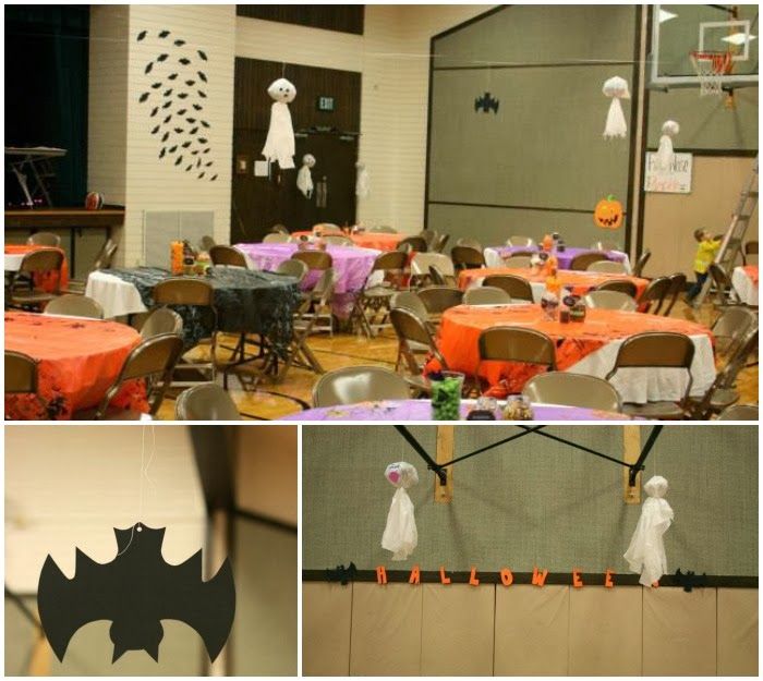 halloween decorations are hanging from the ceiling and tables