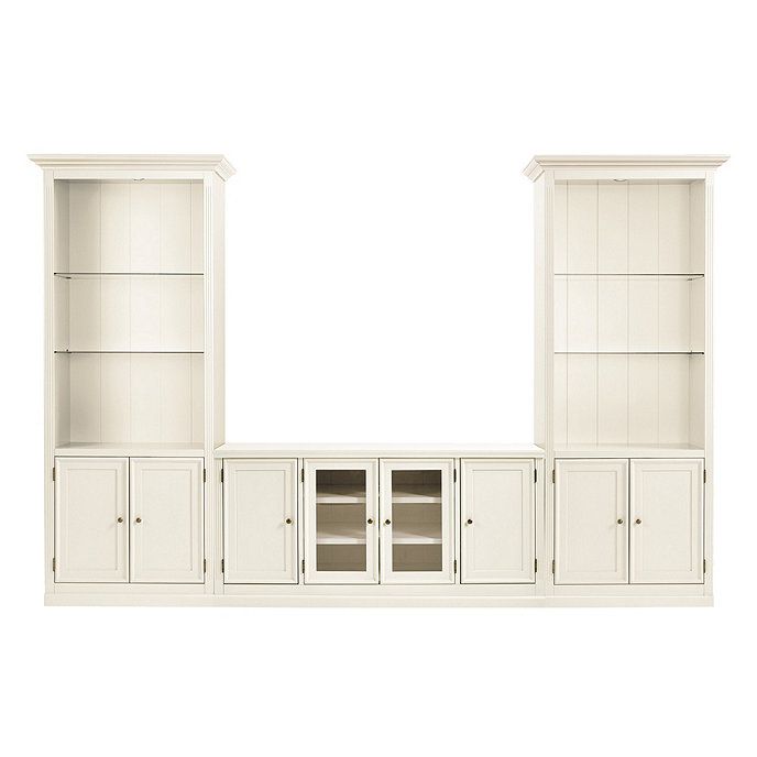 a white entertainment center with glass doors and cupboards on the front, side by side