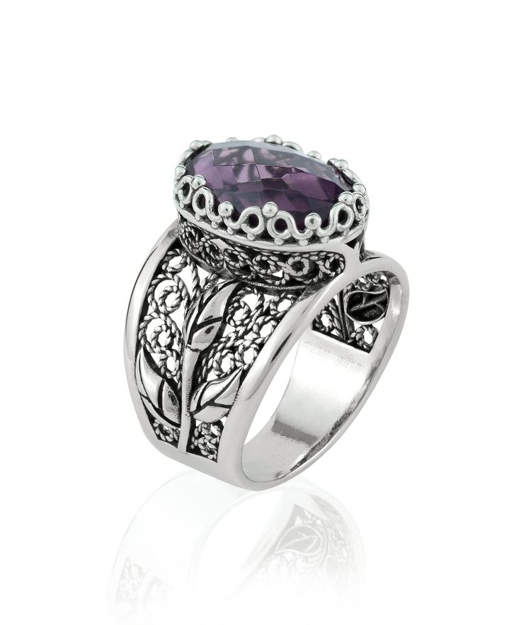 "This 925 Sterling Silver Women Embroidery Cocktail Ring is the perfect gift for her. With its Filigree Art Tulip Detailed Gift Ring design and dark purple Amethyst Gemstone, it's perfect for any occasion.        The Amethyst Gemstone is 10X14 mm, double side faceted, checkerboard oval-cut and the ring face length is 0.60\" / 15.00 mm and width is 0.45\" / 11.50 mm.          Embellish your fingers with enchanting details. Delicate and feminine, this ring features stunning lace-like details. The perfect finishing touch to any outfit, this ring is also great for everyday use. With its beautiful purple stone and delicate silverwork, this ring is a true stunner. Give the gift of elegance this holiday season. It could be your Christmas, New Year, Thanksgiving, Birthday, Anniversary, Mother`s Da Luxury Silver Amethyst Ring Modern Style, The Ring Face, Silver Polish, Blue Stone Ring, Blue Topaz Stone, Statement Ring Silver, Box Making, Sterling Silver Filigree, Purple Stones