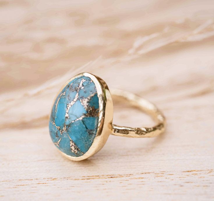 Admiring our Barbara Ring in all it's angles! 😍 Copper Turquoise is natural Turquoise that has been crumbled and reformed to add copper to it, in order to create the beautiful effect of the stone! Would you wear this ring? 👇🏻 Fine Jewelry In 14k Gold With Turquoise, Turquoise 14k Gold Fine Jewelry, 14k Gold Turquoise Fine Jewelry, Adjustable Gold Turquoise Ring For Wedding, Bohemian 14k Gold Gemstone Jewelry, Gold Turquoise Ring With Birthstone For Anniversary, Gold Turquoise Ring With Gemstone, Gold Teardrop Gemstone Ring, Gold Turquoise Ring In Sterling Silver