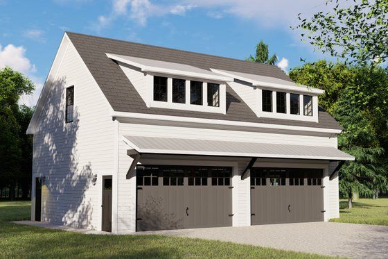 a two car garage with three windows on the top floor and an attached carport