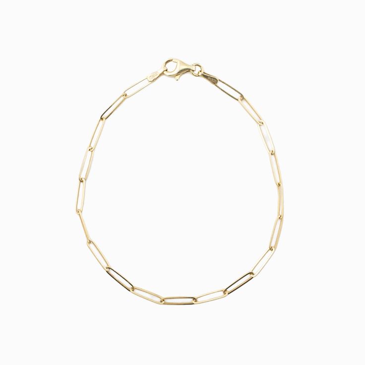 "Simple and delicate bracelet perfect for everyday wear. This bracelet is both dainty and comfortable, making it an ideal addition to any outfit. This paperclip chain bracelet is a stylish and modern piece of jewelry that features a chain made up of interlocking paperclip-shaped links. This type of bracelet is typically crafted from 14 karat gold, which is a high-quality and durable material that is prized for its rich, warm color and lustrous finish. The bracelet is designed to be lightweight and comfortable to wear, making it ideal for everyday use or special occasions. With its sleek and contemporary design, a 14k gold paperclip chain bracelet is a versatile accessory that can be dressed up or down to suit any style. * Made of 14k solid gold * Bracelet length: 7\" * Lobster clasp" Elegant Paperclip Bracelet With Cable Chain For Everyday, Classic Everyday Paperclip Bracelet With Delicate Chain, Minimalist 14k Gold Oval Link Bracelets, Minimalist Yellow Gold Bracelet With Rectangular Links, Minimalist 14k Gold Oval Link Bracelet, Minimalist 14k Gold Bracelet, Classic Gold Bracelet With Rectangular Links For Everyday, Dainty 14k Gold-filled Paperclip Bracelet For Everyday, Dainty 14k Gold Filled Paperclip Bracelet For Everyday