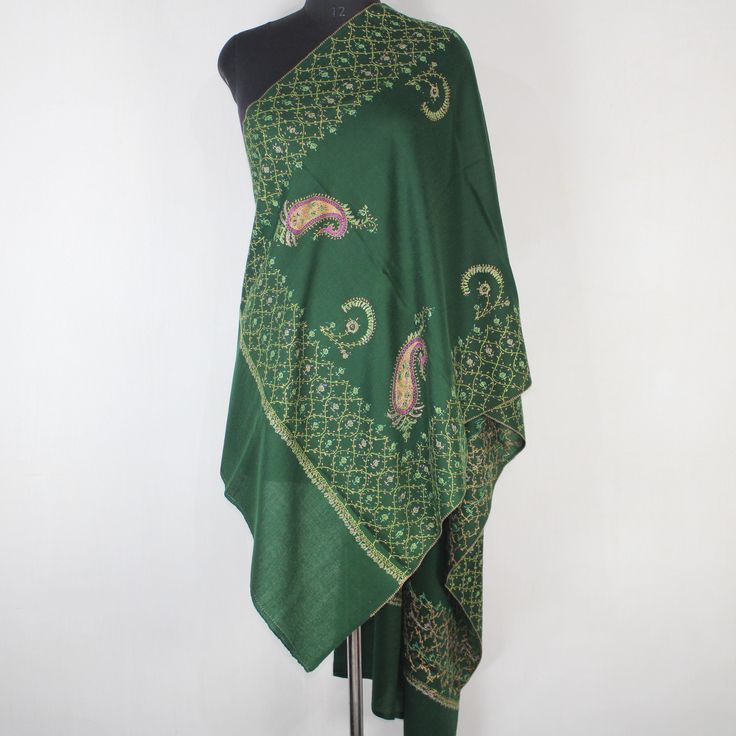 Kashmiri sozni Embroidered Wool Stole.This Multi Color Stole Is Made Of Fine Merino Wool Its Embroidered With Multi Colours.The Embroidery Done On This Is A Traditional Kashmiri Embroidery Known As 'sozni Work''.Now Own A Rare Genuine Kashmiri Hand Embroidered Stole Which Takes Many Months To Create, Unique In Design And Colour And, Have Never Been Replicated. Condition: Brand New Size: 28" X 80" (70 Cm X 200 Cm) Approx Colour: Green Style: Scarf Wrap Material: Fine Merino Wool Embroidery:  sozni Work (needle work) Washing : Hand Wash Only (Use Cold Water) Ironing: Use Steam Ironing Free Shipping : Yes Festive Embroidered Pashmina Fabric, Transitional Embroidered Pashmina Shawl, Multicolor Embroidered Shawl With Traditional Drape, Embroidered Pashmina Shawl For Transitional Seasons, Traditional Embroidered Green Shawl, Transitional Festive Embroidered Pashmina Shawl, Embroidered Green Shawl Dupatta, Green Embroidered Shawl Dupatta, Green Shawl With Resham Embroidery In Traditional Drape