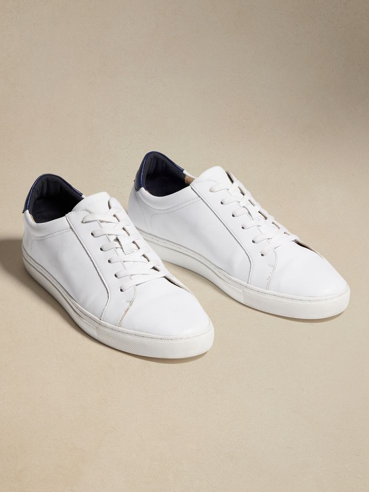 Exquisitely crafted for ultimate versatility, our Nicklas leather sneakers sport a minimal design so they pair just as easily with tailored suiting as your softest sweats.  Flexible, leather upper.  Rubber soles.  Flat laces.  Whole and half sizes. Classic Low-top Sneakers For Light Sports, Classic Sneakers With Vulcanized Sole For Light Sports, Classic Lace-up High-top Sneakers For Light Sports, Classic Low-top Slip-on Sneakers With Leather Sole, Leather Sneakers With Vulcanized Sole For Light Sports, Classic Low-top Custom Sneakers For Light Sports, Leather Slip-on Sneakers For Spring Everyday Wear, Classic High-top Sneakers With White Sole And Laces, Classic High-top Sneakers With White Sole For Light Sports