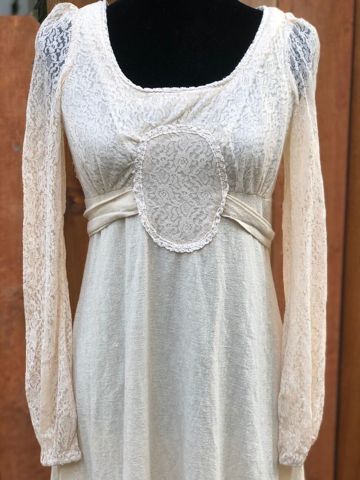 "Gorgeous dress! I love the cool center with the tie back waist.. this dress is made out of a \"raw\" cotton and it is soft! There is one small stain but it is not that noticeable since it sort of blends in with the cotton. Some fraying at end seams, and an area where the lace has separated some (see photo) on bodice.. Good vintage condition! All measurements are taken while garment is laid flat. Please double for a proper fit. Underarm-17\" Bust-16\" Waist-15\" (more of an empire waist) Length-53\" Thank you for looking! My items come from a smoke free and cats loved home. Please read all policies before purchase." Cotton Maxi Dress With Fitted Bodice, Elegant Cotton Maxi Dress With Lace Trim, Cotton Maxi Dress With Tie Back For Casual Wear, Cotton Maxi Dress With Tie Back For Casual Occasions, Fitted Long Cotton Maxi Dress, Fitted Empire Waist Dress With Tie Back, Fitted Cotton Maxi Dress With Tie Back, Cotton Long Sleeve Dress With Fitted Bodice, Cotton Long Sleeve Fitted Dress