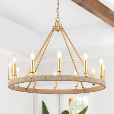 a chandelier hanging from the ceiling in a room with white walls and wooden beams