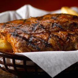 grilled steak and french fries in a basket