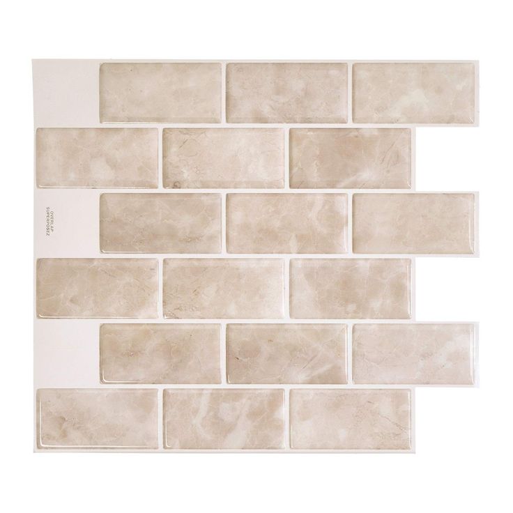 a white tile wall that is made out of different types of tiles