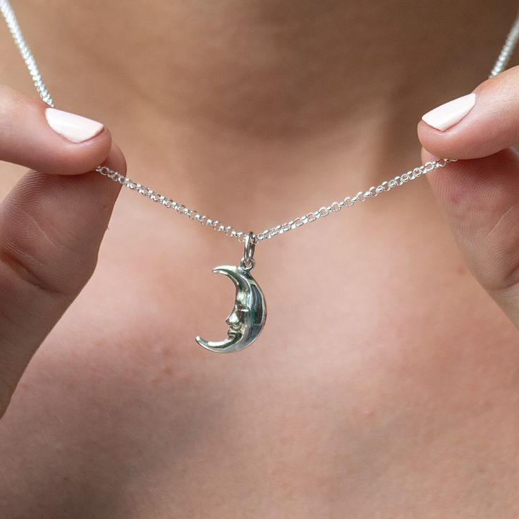 This delicate sterling silver moon charm necklace contains the quirky yet warm features of the man on the moon looking out in protection. As one of the oldest symbols in the world, our perfect crescent design represents new beginnings and the ability to turn dreams into reality.  All our charms attach with a clip-on clasp and are compatible with all other leading charm jewellery brands. Simply clip-on or slide-on to a chain, charm bracelet or charm carrier necklace.  All Lily Charmed jewellery c Silver Necklace Women, Unique Jewelry Silver, Handmade Metal Necklaces, Necklace Inspo Silver, Jewellery Inspo Silver, Cute Necklaces Silver, Pretty Jewellery Silver, Full Moon Jewelry, Silver Moon Necklace