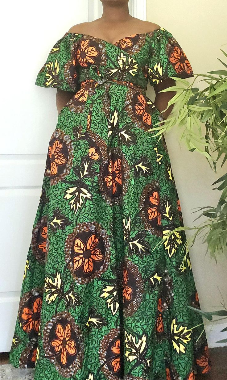 This stunning women's wrap maxi dress is sure to turn heads! With a colorful African print and off-the-shoulder neckline, this dress is perfect for any occasion - from weddings and parties to casual outings. The flared sleeves and ruffle accents add a touch of elegance, while the tie closure and belted waist create a flattering silhouette. Made from machine-washable polyester, this dress is both comfortable and easy to care for. Perfect for nature lovers and beach-goers alike, this dress features a playful pattern with flower and princess themes. Handmade with care, this dress is sure to make you feel confident and beautiful. Available in size M, L, and XL. This wrap dress is a must-have for any fashion-forward woman. Green A-line Midi Dress For Vacation, Green Printed Midi Dress For Garden Party, Garden Party Green Printed Midi Dress, Bohemian Green Midi Dress With Vibrant Print, Green Bohemian Midi Dress With Vibrant Print, Green Spring Maxi Dress With Vibrant Print, Spring Green Maxi Dress With Vibrant Print, Green Maxi Length Off Shoulder Dress, Green Off-shoulder Fitted Maxi Dress