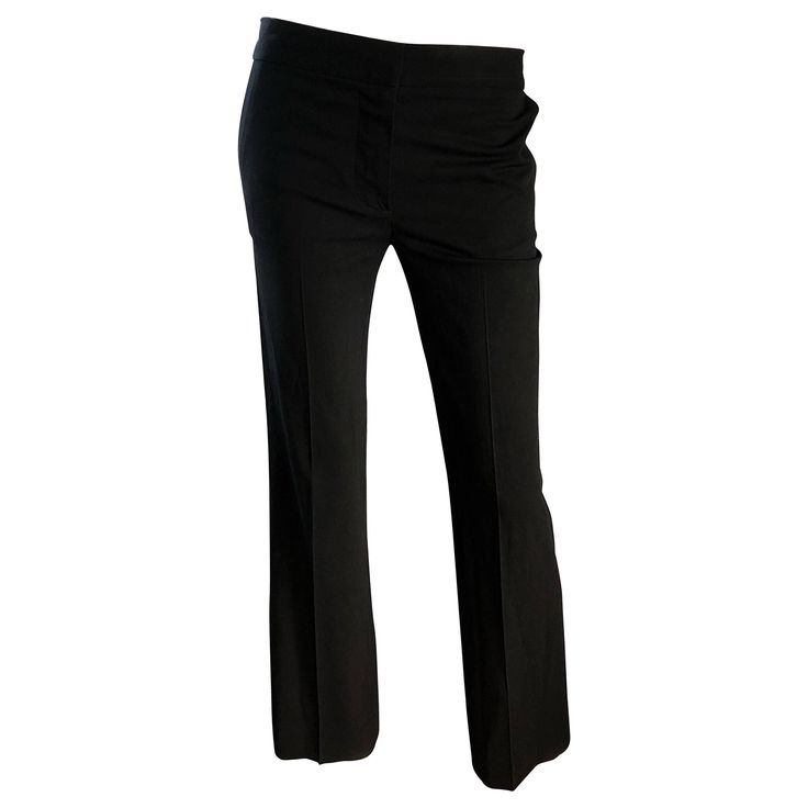 Classic and collectible for CHLOE black silk flared leg low rise trousers! Soft sturdy silk that holds shape nicely. Tailored fit, with a wider flare leg. Sits low on the hips, with button closure at waistband and zipper fly. Pockets at each side of the hips, and one pocket on the rear. Very flattering and versatile. The pictured Jean Paul Gaultier black crop top is also available in my 1stDibs Shop. Perfect for all year. In great unworn condition. Made in France Marked Size EU 36 / US 4 - 6 Mea Elegant Stretch Flares, Elegant Stretch Straight Leg Flares, Elegant Stretch Flares With Straight Leg, Elegant Mid-rise Business Bottoms, Fitted Mid-rise Formal Pants, Elegant Mid-rise Bottoms For Business, Formal Fitted Mid-rise Pants, Elegant Black Mid-rise Pants, Elegant Fitted Flare Pants