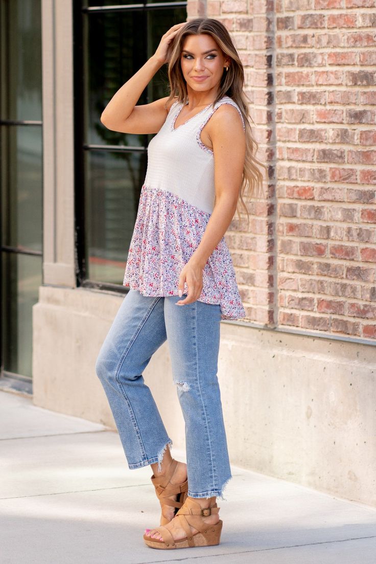 The Smocked Printed Peplum Sleeveless Top is a trendy and feminine piece that features a flattering peplum silhouette and stylish smocked detailing. The printed design adds a pop of color and personality to the top, making it a fun and eye-catching choice for various occasions. With its sleeveless construction, this top is perfect for warm weather and can be easily layered for cooler days. The smocked bodice provides a comfortable and figure-enhancing fit, while the peplum hem adds a flirty touc Peplum Hem, Printed Design, Stretchy Material, Warm Weather, Smocking, Bodice, Sleeveless Top, Color Pop, Night Out