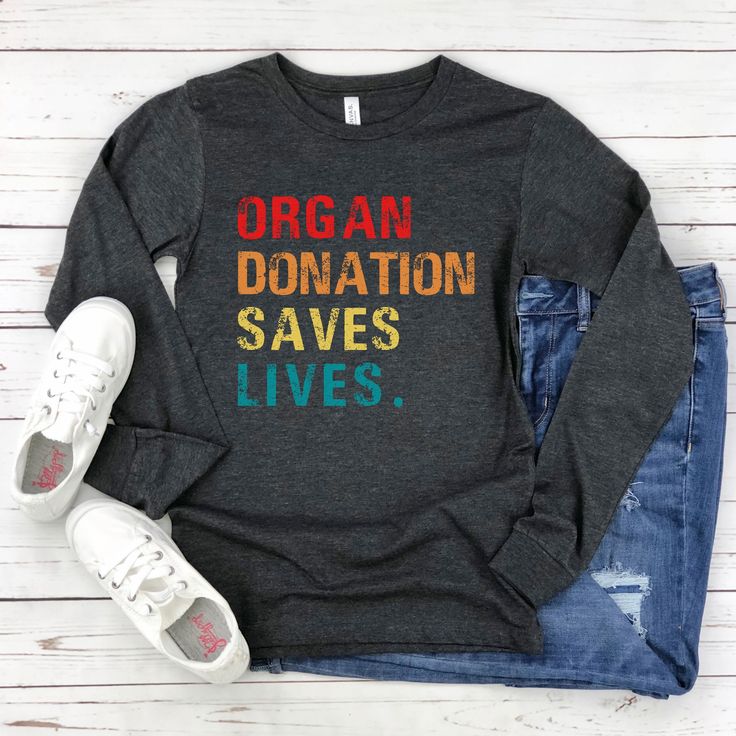 This long sleeve tee is a great gift for someone who has had a transplant and is a great way to help raise awareness of organ donation.  Soft and fashionable Bella Canvas 3501 long sleeve t-shirt. 👕Sizing: Sizes range from Small - 2XL * 100% combed and ring-spun cotton * Heather colors are 52% combed and ring-spun cotton, 48% polyester * Athletic Heather is 90% combed and ring-spun cotton, 10% polyester * Fabric weight: 4.2 oz/yd² (142.4 g/m²) * Regular fit * Side-seamed construction * Crew nec Relaxed Fit Long Sleeve T-shirt For Gift, Relaxed Fit Long Sleeve T-shirt As Gift, Pre-shrunk Long Sleeve T-shirt As A Gift, Long Sleeve Screen Print T-shirt Gift, Long Sleeve Screen Print T-shirt As Gift, Long Sleeve Pre-shrunk T-shirt As Gift, Long Sleeve T-shirt With Text Print For Gift, Text Print Long Sleeve T-shirt For Gifts, Long Sleeve Graphic Tee T-shirt As Gift