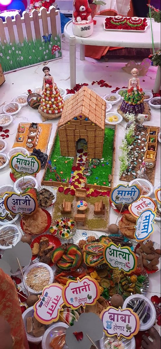 a table covered with lots of different types of food and decorations on top of it