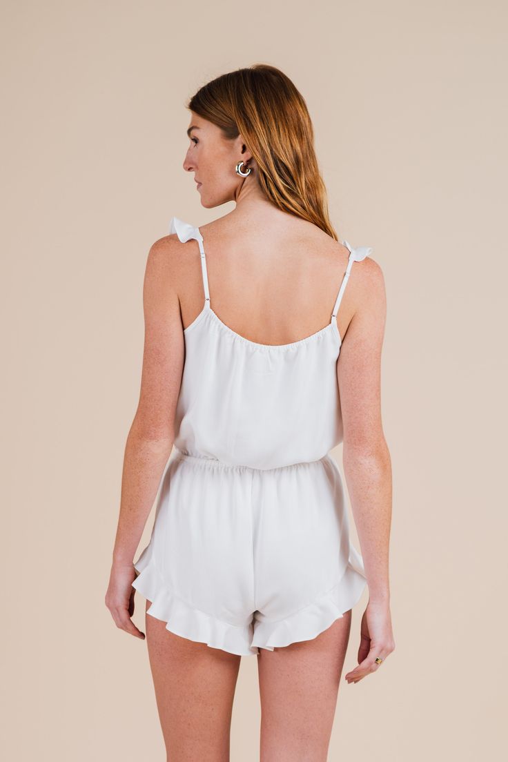 Slip into our Ruffle Romper for sumptuous and stylish dreams. The perfect way to dream day or night, this women’s romper features an elastic waistband with tie and elastic adjustable strap to glide with your every move. This women's romper has elastic at the high waist with a functioning tie for adjustability. Ruffle detail on the straps and hem with scooped detail at the side seam. Available in Cloud (white) and Dusty Sunrise (blush) Adjustable elastic straps Elastic with tie at waist 100% Tenc Dream Day, Ruffle Romper, Sleepwear Women, Rompers Women, Loose Fitting, Rompers, High Waisted, Elastic