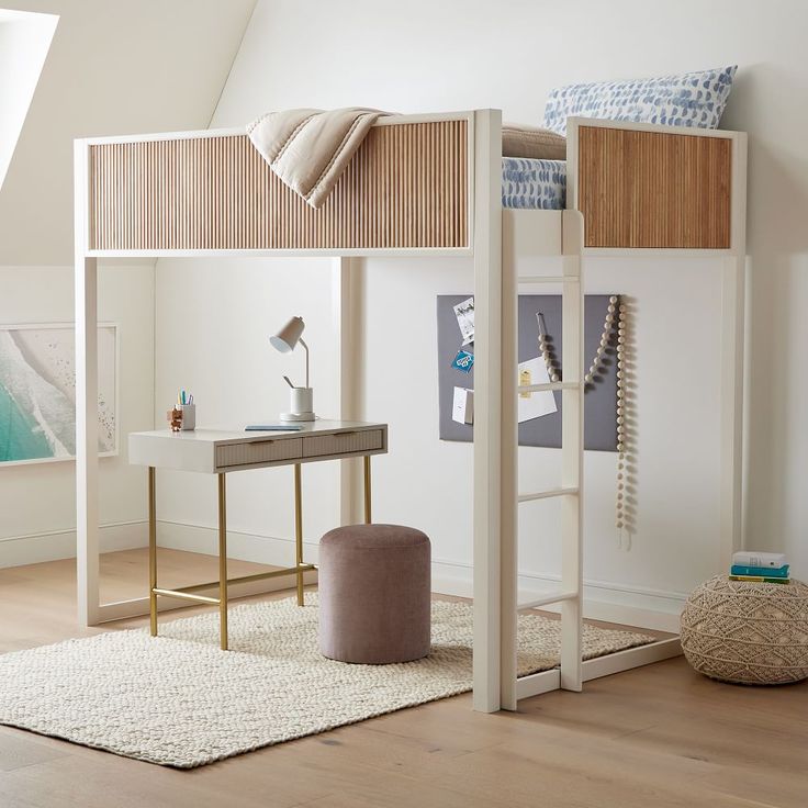 a loft bed with a desk underneath it in a room that has white walls and wood floors