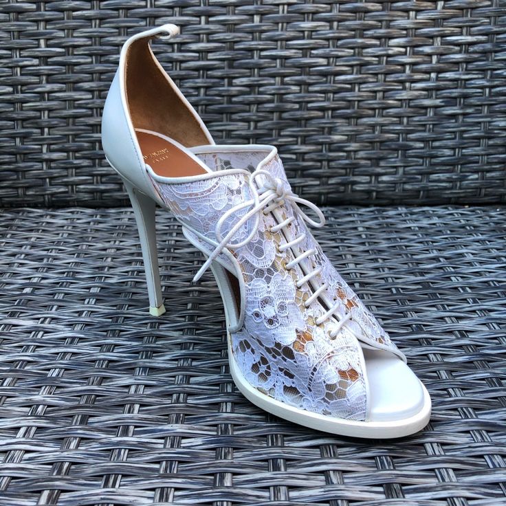 New Givenchy Floral Lace Peep Toe Sandals. Retail $1,390.00. Size: 38.5eu. Color: White. Heel Height: 4.5". Floral Lace Upper With Leather Backing. Peep Toe. Lace Up Style. Leather Lining And Sole. Made In Italy. Condition: New Never Worn Shoes With Minor Marks/Missing Ankle Straps. Box Not Included. Chic Fitted Open Toe Lace-up Sandals, Luxury High Heel Lace-up Sandals For Spring, Spring Formal Lace-up Sandals With 4-inch Heel, Luxury High Heels For Spring, Elegant Fitted Lace-up Sandals For Summer, Luxury Round Toe Wedding Shoes For Spring, Luxury Spring Wedding Shoes With Round Toe, Formal Lace-up Sandals, Spring Wedding Shoes With Wrapped Heel And Round Toe