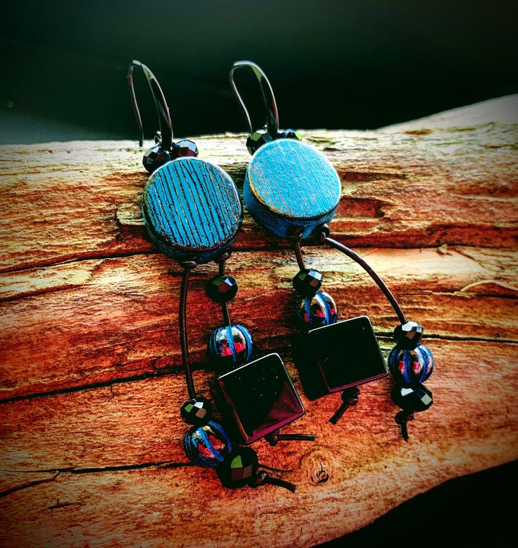 These one of their kind earrings feature handmade artisanal turquoise blue and black disc beads by MysticPeasantBeads, black thread dangles with two large shiny black Agate stone cubes, ten black faceted crystals and four Turquoise Picasso finish Czech glass beads.   They are strung in modern black ear wires. Return to my shop: JewelryBySmita.etsy.com All copyright & intellectual property rights in my designs, products, images & text are the property of Smita Luthra. All rights reserved. -------------- Blue Black Earrings, Black Crystal Dangle Earrings, Black Agate Gemstone Earrings, Unique Turquoise Blue Disc Earrings, Bohemian, Handmade Black Agate Stone, Blue Disc, Black Earrings Dangle, Bohemian Handmade, Crystal Dangle Earrings, Disc Earrings, Earrings Bohemian, Bleu Turquoise, Earrings Unique