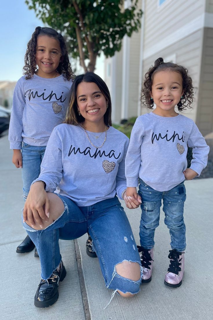 *Each top sold separately* Mom & me tops feature long sleeves perfect for cool weather wear Long sleeve shirts feature an allover gray design Mom top reads "Mama" and child top reads "Mini" Ultra soft material for comfort & ease all season long Twinning is winning! Match with your little one in our "Mama & Mini" Gray Long Sleeve Tops. These tops feature long sleeves and a fun gray print. In a versatile design, this top is made from soft and breathable fabric that will keep her comfy during all a Mom And Daughter Matching, Sparkle In Pink, Top Reads, Children Top, Baby Top, Design Mom, Child Baby, Weather Wear, Sister Shirts