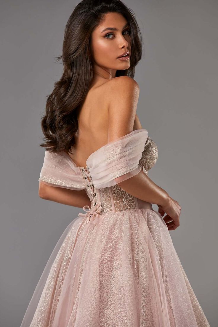 This off-the-shoulder sparkling tulle midi dress was inspired by the feminine looks of the nineteenth century. The corset is decorated with bones and a combination of monotone and sparkling semi-transparent fabric. Sheer off-the-shoulder tulle sleeves accentuate the neckline and make your look magnificent. The A-line midi skirt is made of puffy tulle fabric. The dress goes in misty rose, melon and silver. Where to wear the combination tie shoulder cocktail dress:- prom parties- birthday celebrat Sparkly Corset, Glitter Corset, Midi Tulle Dress, Silver Midi Dress, Cocktail Dress Code, Milla Dresses, Tie Strap Dress, Sleeves Details, Gown For Prom