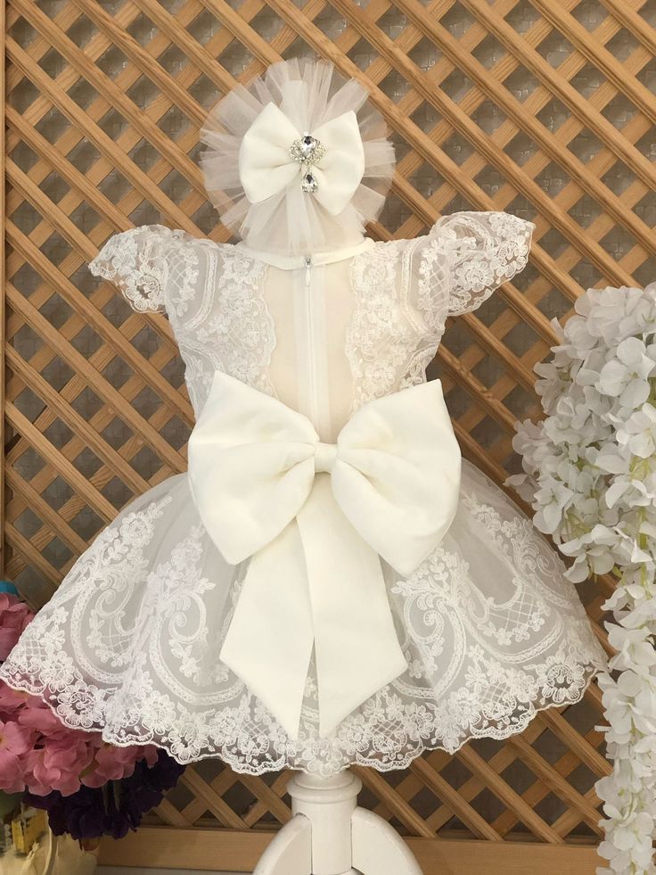 Lace Flower Baby Girl Dress, Baby Wedding Dress, Baptism Dress for Girls, Baby Party Dress, 1st Birthday Dress, Baby Princess Dress This baby girl dress is specially designed and handmade for your baby girl. Your girl will be like a princess with these dresses that she can wear on special occasions such as birthdays, weddings and christmas. This dress, which will create your girl's style with a clasp and shoes, is ideal for special occasions. Check out our baby girl dresses selection for unique handmade dresses from AymiraDesign. ✿ Product Features; ✰ Baby Dress Materials: Tulle, Lace ✰ Baby Dress Color: White ✰ Set Content: Dress, Clasp, Shoes ✰ Size Options: * 0-3 months, 3-6 months, 6-9 months, 9-12 months, 12-18 months, 18-24 months, 2T, 3T, 4T, 5, 6 US kids' numeric ✰ Note: Shoes are Fitted Tutu Dress With Bow For Baptism, Fitted Tulle Baptism Dress With Bow, Fitted Princess Wedding Dress With Bow, Fitted Wedding Princess Dress With Bow, Elegant Baptism Dress With Bow For Party, Cream Wedding Dress With Bow, Elegant Baptism Tutu Dress With Bow, Elegant Tutu Dress With Bow For Baptism, Fitted Tutu Dress With Bow For Wedding