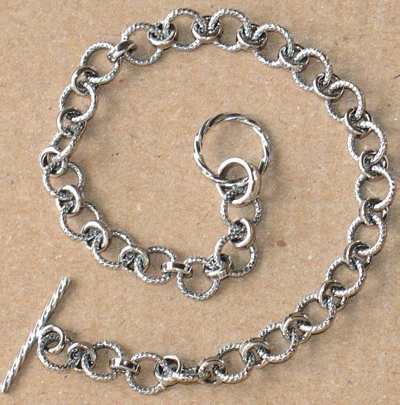 Antiqued Sterling silver fancy link bracelet with toggle clasp 71/2 inchesLinks size:4X6mm Toggle size:10mm round X 12.5mm long Metal Chain Bracelet With Toggle Clasp And Oval Link, Adjustable Oval Link Chain Bracelet With Toggle Clasp, Elegant Nickel-free Metal Toggle Necklace, Classic Metal Charm Bracelet With Sterling Silver Clasp, Metal Chain Link Jewelry With Toggle Clasp, Adjustable Silver Metal Toggle Necklace, Silver Metal Oval Link Chain Bracelet, Metal Link Bracelets With Rolo Chain, Metal Chain Bracelet With Rectangular Links And Toggle Clasp