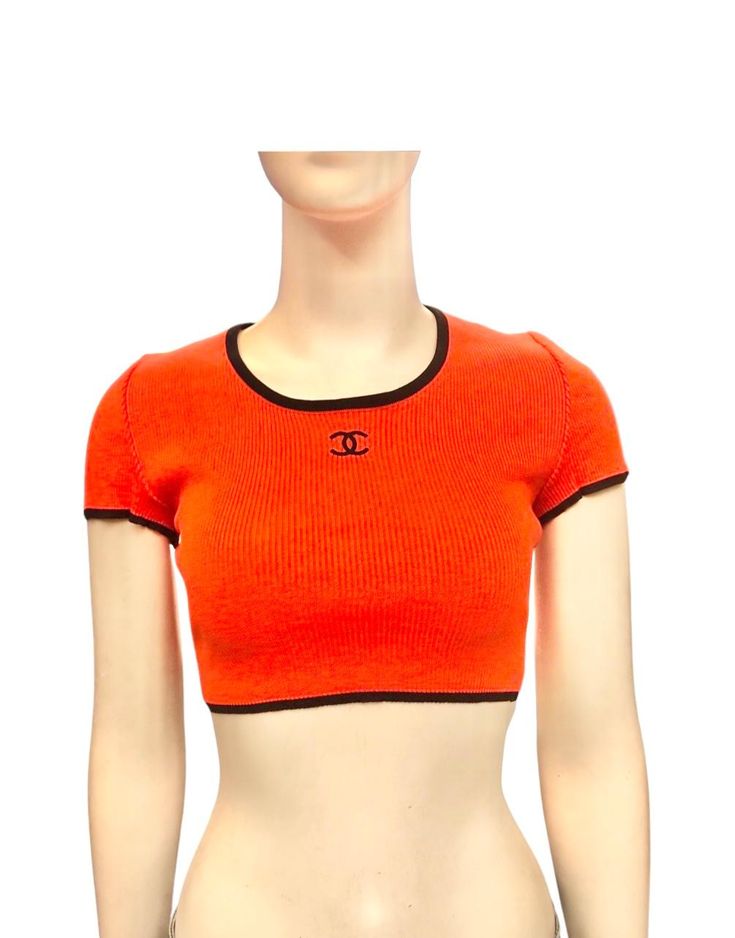 - Chanel orange cotton "CC" cropped top from spring 1995 collection. - Black piping trim. - Size 44. Orange Stretch Crop Top, Stretch Orange Cropped Top, Fitted Cropped Orange Top, Fitted Orange Cropped Top, Chanel Orange, Chanel Top, Chanel Collection, Chanel Vintage, Cropped Tops