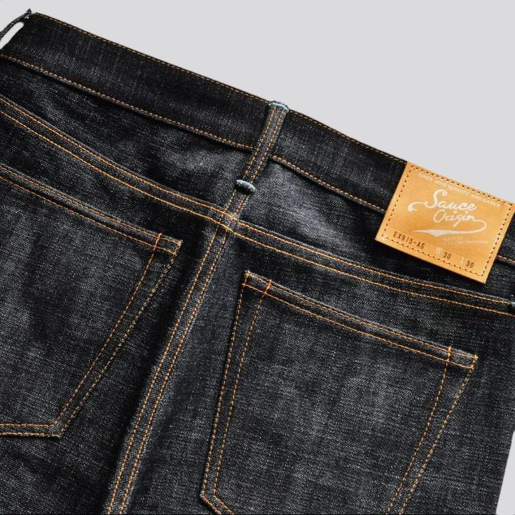 Make a quintessential fashion statement this season with our Tapered 16oz Men's Selvedge Jeans from the 2023 Autumn Collection! Crafted with heavyweight, 16oz denim and selvedge style, these jeans are a harmonious blend of conventional sophistication and trendy appeal. Boasting real silver buttons and a mid-rise fit, they offer a look of raw elegance. Handmade with Japan Blue, these jeans are captivating in every way.Why These Tapered Selvedge Jeans Are A Must-HaveThis unique piece of denim is p Urban Selvedge Jeans With Straight Hem, Selvedge Denim Jeans With Tapered Leg, Selvedge Recycled Denim Tapered Leg Jeans, Black Selvedge Jeans With Straight Hem, Selvedge Denim Jeans With Standard Cut Leg, Dark Wash Straight Selvedge Jeans, Standard Cut Leg Denim Jeans, Urban Dark Wash Selvedge Jeans, Straight Selvedge Jeans In Dark Wash